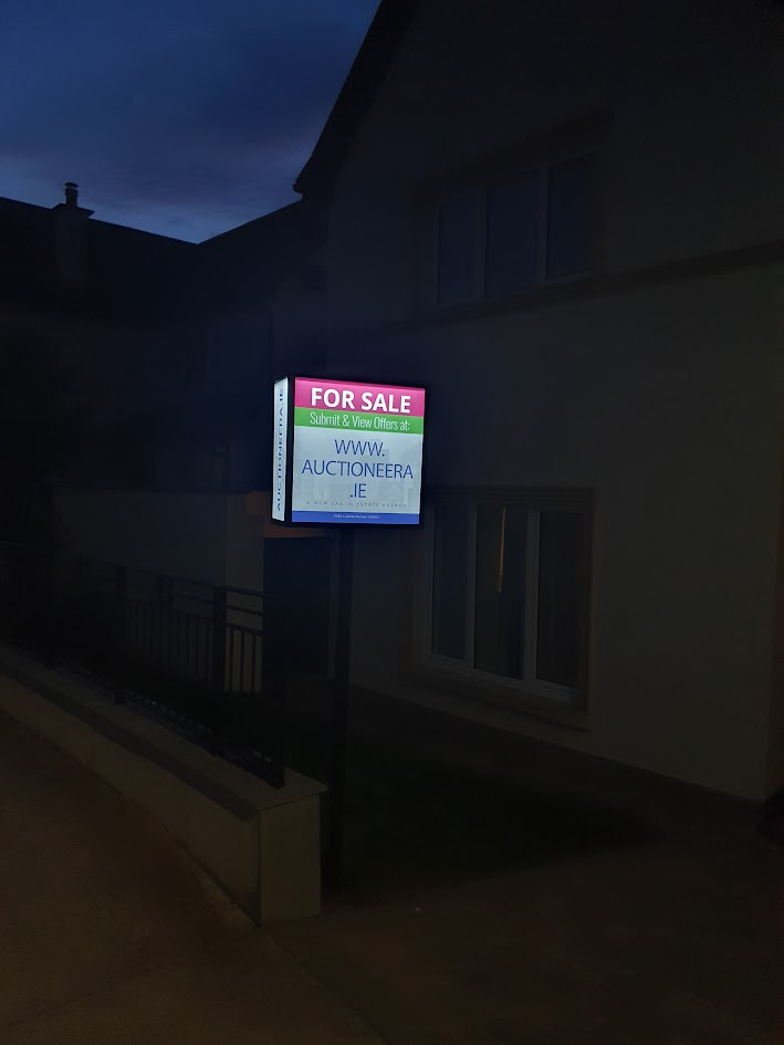 Estate agent unveils solar power For Sale signs